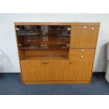 A teak effect cocktail display sideboard