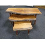 A nest of three rustic oak tables