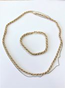 An 18ct gold two-tone rope twist necklace and matching bracelet, lengths 50cm and 20cm respectively.
