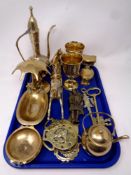 A tray containing a quantity of brass ware to include brass keys, horse brasses, soap dish,