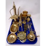 A tray containing a quantity of brass ware to include brass keys, horse brasses, soap dish,