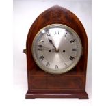 A 19th century inlaid mahogany arch topped mantel clock by J M.