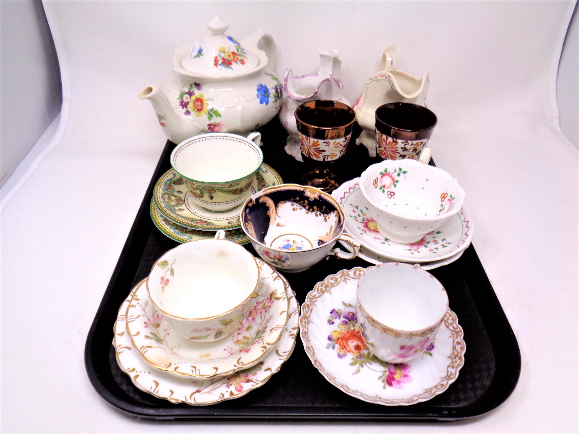 A tray containing a Saddler teapot, pair of copper lustre goblets,