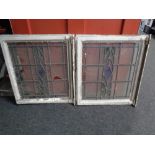 A pair of antique stained leaded glass windows in original frames (as found)