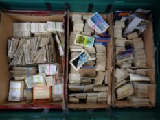 A crate containing a large quantity of cigarette and tea cards to include Ringtons, Brook bond,