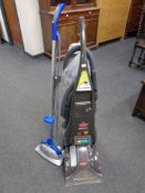 A Bissel pro heat floor cleaner together with a further floor buffer