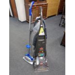 A Bissel pro heat floor cleaner together with a further floor buffer