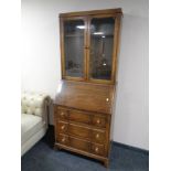 An Edwardian oak bureau bookcase