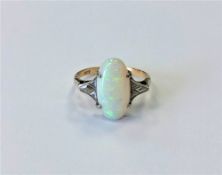 A 9ct gold opal ring, size P CONDITION REPORT: 2.