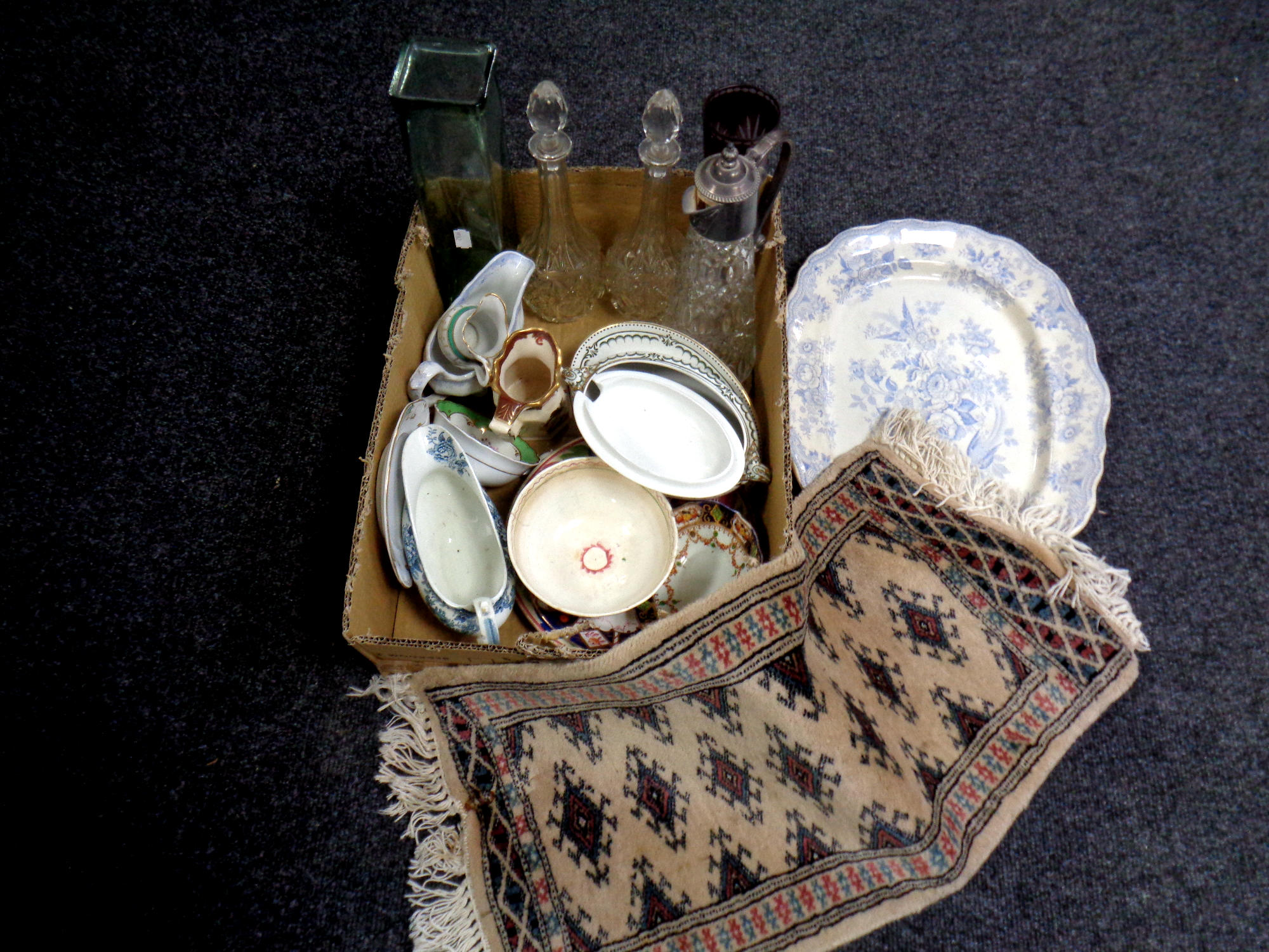 A box containing antique and later ceramics, glassware, claret jug,