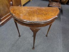 A 20th century walnut demi-lune turnover top card table