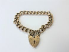 A 9ct gold padlock bracelet CONDITION REPORT: 26.
