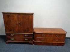 A contemporary yew wood entertainment cabinet together with a similar low TV cabinet