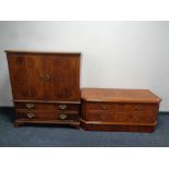 A contemporary yew wood entertainment cabinet together with a similar low TV cabinet