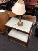 A 20th century melamine topped oak trolley together with a standard lamp