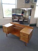 A 20th century teak Handcraft Quality Furniture sunk centre dressing table