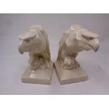 A pair of crackle glaze pottery eagle head book ends