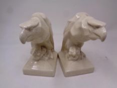 A pair of crackle glaze pottery eagle head book ends