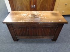 A carved oak blanket chest