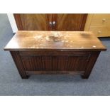 A carved oak blanket chest