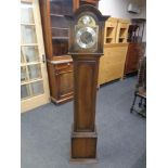 A Tempus Fugit oak cased granddaughter clock