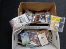 Two boxes containing a large quantity of mid 20th century and later football and rugby programmes,