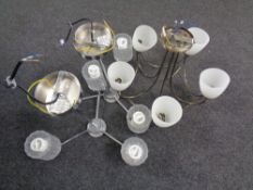 Two contemporary chrome three way light fittings with glass shades together with a further five way