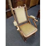 An Edwardian beech folding rocking chair