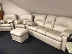 A four piece G Plan cream leather lounge suite comprising of three seater settee and armchair,