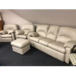 A four piece G Plan cream leather lounge suite comprising of three seater settee and armchair,