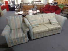 A three piece Victorian style lounge suite upholstered in a two-tone fabric comprising of drop-end