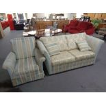 A three piece Victorian style lounge suite upholstered in a two-tone fabric comprising of drop-end