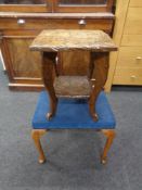 A heavily carved two tier occasional table together with a dressing table stool