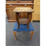 A heavily carved two tier occasional table together with a dressing table stool