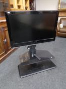 A Toshiba Regza 37" LCD TV with remote on stand