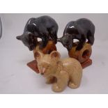 A pair of mid 20th century Russian Konakovo bear figures together with a further Sylvac figure of a