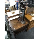 An oak drop leaf serving trolley together with two smokers stands