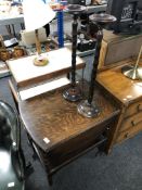 An oak drop leaf serving trolley together with two smokers stands