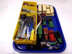 A tray containing a quantity of mid 20th century play-worn Dinky die cast cars and buses together
