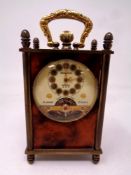 A Swiss miniature mantel timepiece in brass and faux tortoiseshell case.