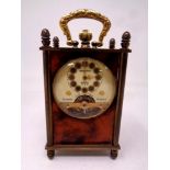 A Swiss miniature mantel timepiece in brass and faux tortoiseshell case.