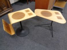 A retro style shaped plywood occasional table with magazine rack on pedestal stand together with a