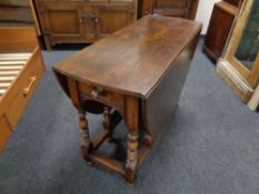 A Titchmarsh & Goodwin oak drop leaf table retailed by Chapman's