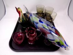 A tray containing antique and later glassware to include cranberry glass jug and heart shaped dish,