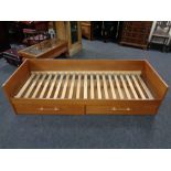 A continental teak day bed