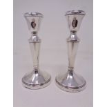 A pair of loaded silver candlesticks, Birmingham marks. Height 14.