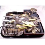 A tray containing a quantity of plated wares including loose cutlery, toast rack, serving tray,