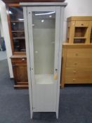 A contemporary pine single door display cabinet