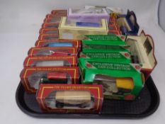 A tray containing twenty five Die cast vehicles to include a Corgi Cameo village collection,