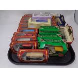 A tray containing twenty five Die cast vehicles to include a Corgi Cameo village collection,